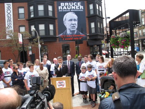 Equality Illinois CEO Bernard Cherkasov addresses the media at the unveiling of the Rauner poster